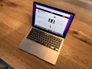 Opened MacBook Pro on wooden table